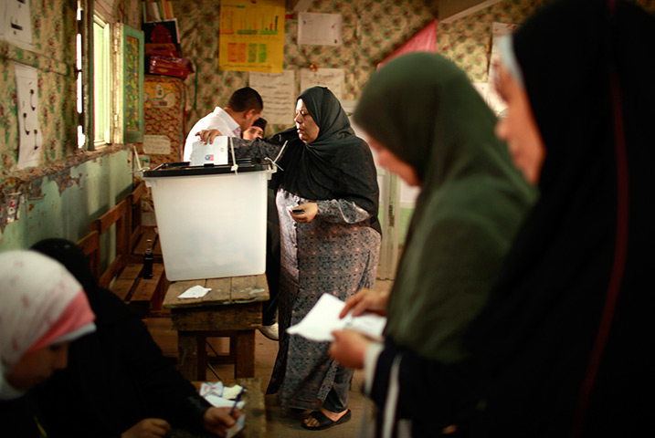 Egypt elections: Egyptian women cast their votes inside a polling station in Cairo
