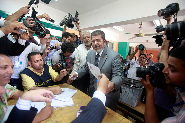 Egypt elections: Presidential candidate Mohamed Mursi prepares to vote