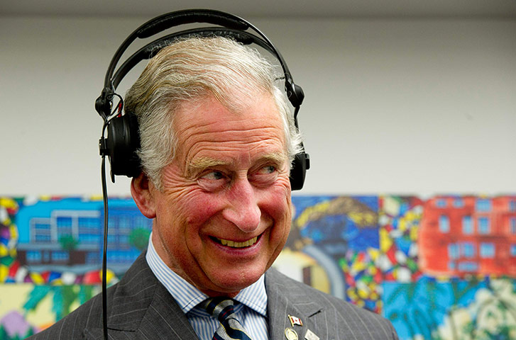 Picture desk live: Prince Charles wears headphones on a visit in Toronto