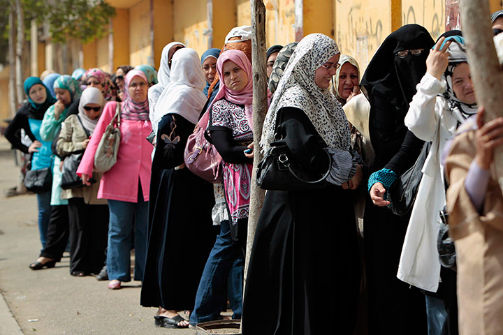 Picture desk live: Women line up to cast their vote at a polling station in Cairo