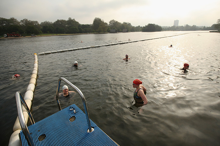 24 hours: London, England: Early morning swimmers in Serpentine lake Hyde Park 