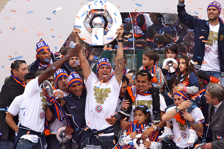 Transfer targets: Montpellier soccer team member Giroud holds their French Champions Cup