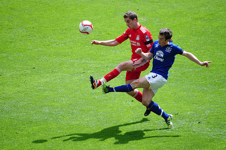 Transfer targets: Jordan Henderson of Liverpool and Leighton Baines of Everton tussle