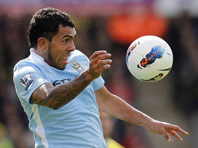 Transfer targets: Manchester City's striker Carlos Tevez heads the ball