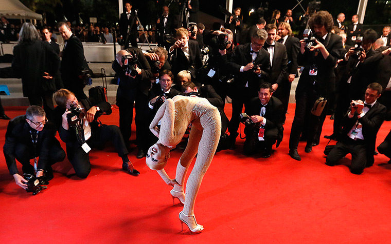 24 hours in pictures: A contortionist performs on the red carpet during the Cannes Film Festival