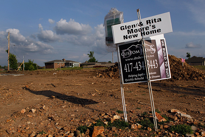 FTA: Joe Raedle: A sign indicates the site of a new home, as the town is rebuilt