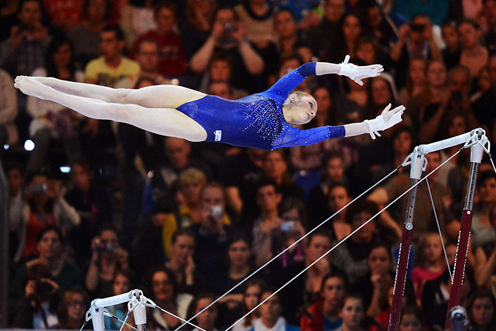 Longer View: Russia's Victoria Komova performs on the uneven bars