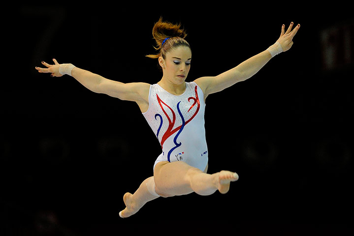 Longer View: France's Youna Dufournet performs on the uneven bars 