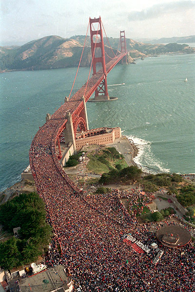 people on bridge: several hundred thousand jams the deck of the Golden Gate Bridge