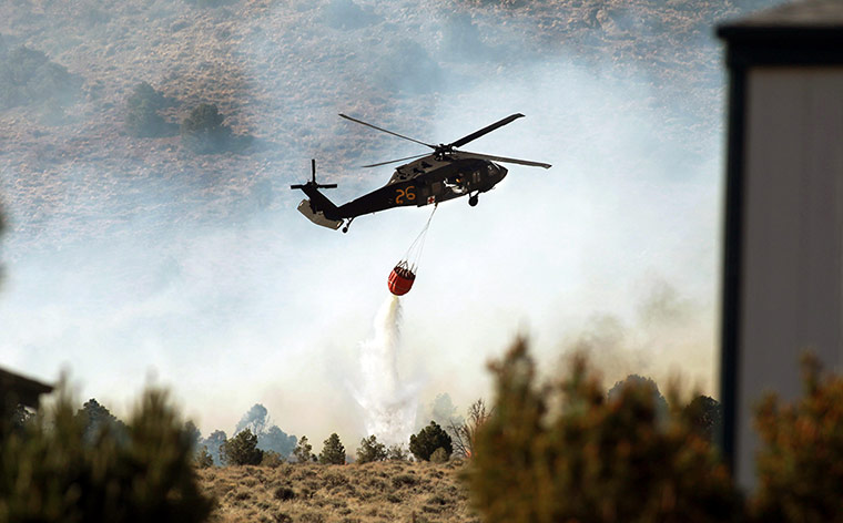Wildfires: Firefighters battle a wildfire south of Gardnerville, Nevada