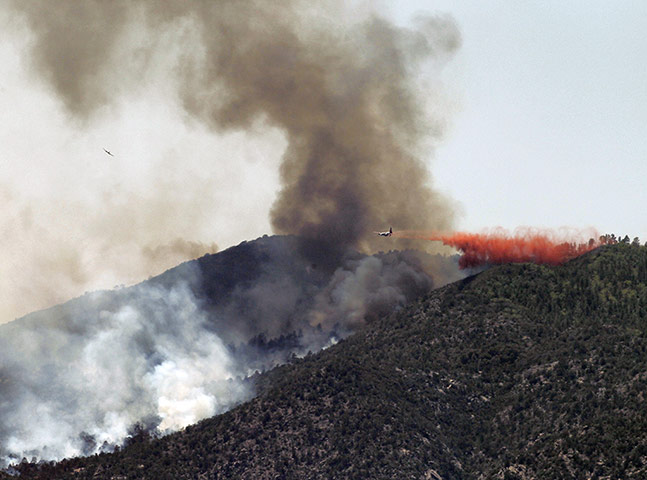 Wildfires: An air tanker drops retardent on a fire
