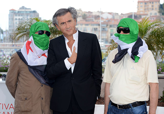 Cannes Day Ten: Director Bernard-Henri Levy poses at Le Serment de Tobrouk 