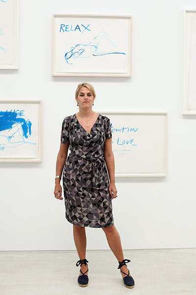 Tracey Emin exhibition: Tracey Emin poses for a picture in front of her artwork