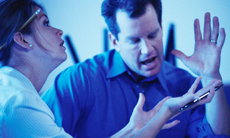 Man and woman arguing in office