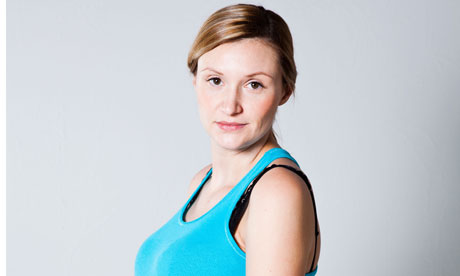 Portrait of a beautiful pregnant woman looking at camera. Studio shot.