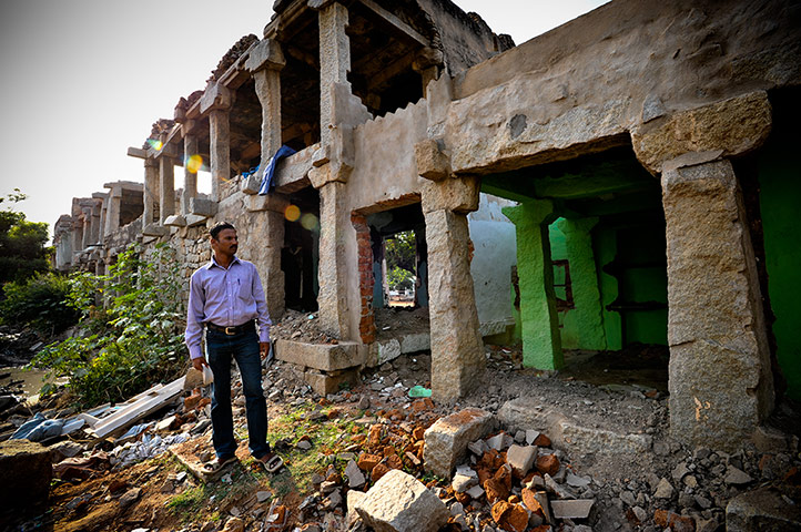 Hampi: P.Hussen stands outside the wreckage of his home in the Hampi bazaar
