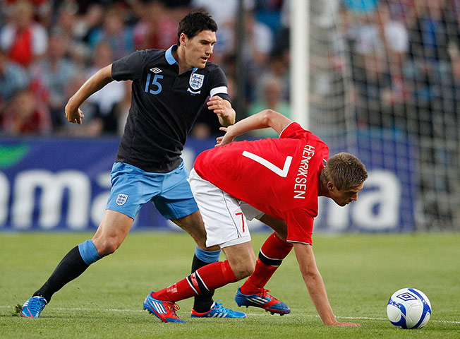 ingurlund v norway: Gareth Barry challenges Norway's Markus Henriksen 