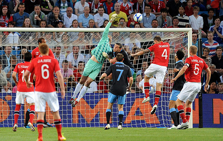 ingurlund v norway: Robert Green tips an effort over the bar