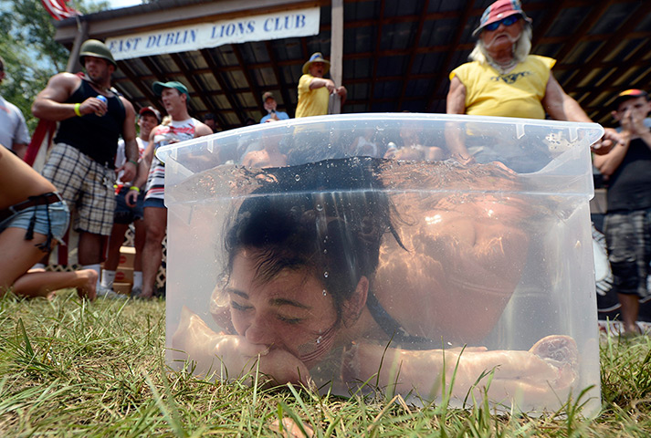 24 hours: East Dublin, Georgia, US: Bobbing for Pigs' Feet at the Redneck Games