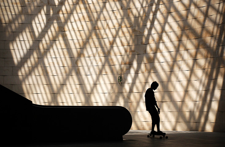 24 hours: Lisbon, Portugal: Skateboarder at the Cais do Sodre subway station