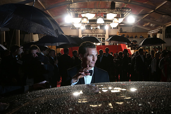 24 hours: Cannes, France: Matthew McConaughey waves as he leaves the Festival Palace