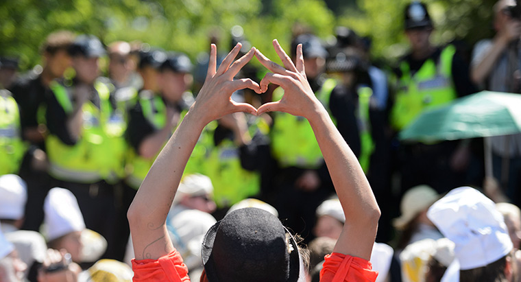 24 hours: Harpenden, England: A protester makes a heart symbol