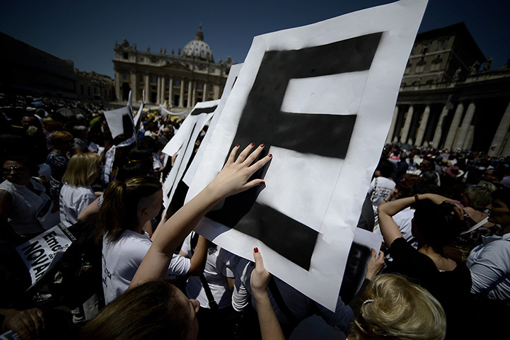 24 hours: The Vatican, Vatican City: Demonstrators hold letters