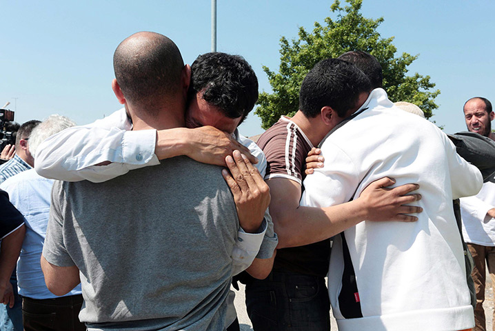 Italy earthquake: Factory workers grieve and console each other outside the Meta factory 