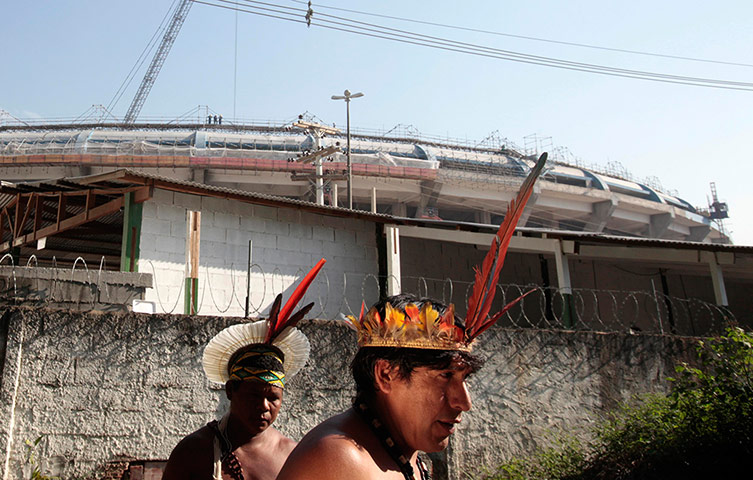 24 hours: Rio de Janeiro, Brazil: Native Indians walk inside the former Indian Museum