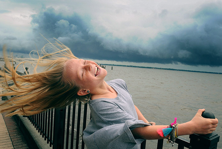 24 hours: Florida, US: Winnie Pajcic, 9, holds on to a railing as she leans back