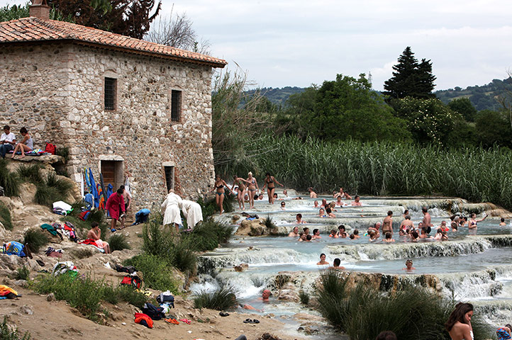 24 hours: Grosseto, Italy: People enjoy Saturnia's Thermal Baths, south of Tuscany