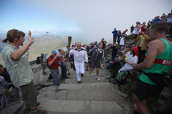 olympic torch relay: Sir Chris Bonington holds the Olympic torch