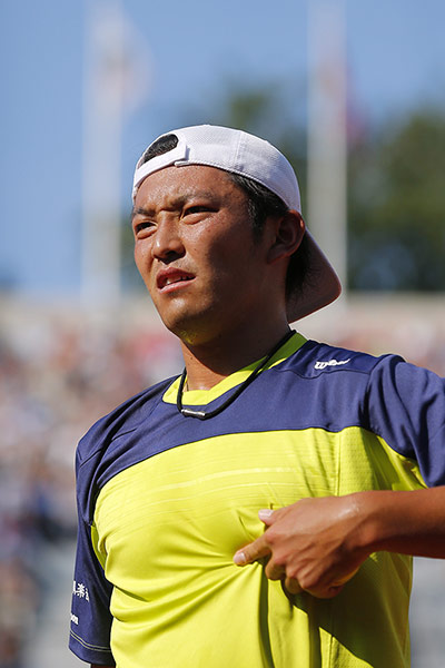 tennis: Japan's Tatsuma Ito waits for ball as he