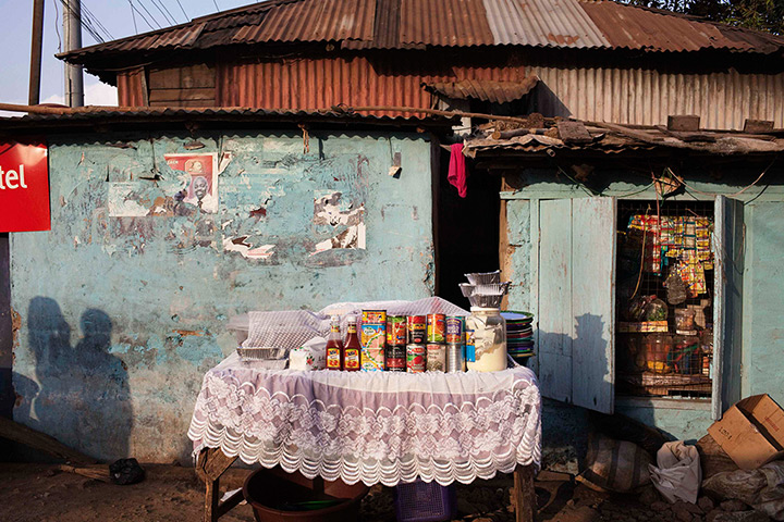 Sierra Leone Architecture: A vendor's kiosk offers goods for sale in the Congo Town