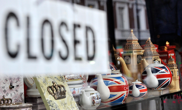 Week in Business: A closed sign hangs in the doorway of a souvenir shop in central London