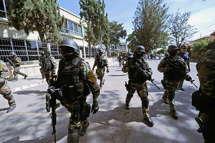 Week in Business: Bolivian soldiers surround the headquarters of an electric company 