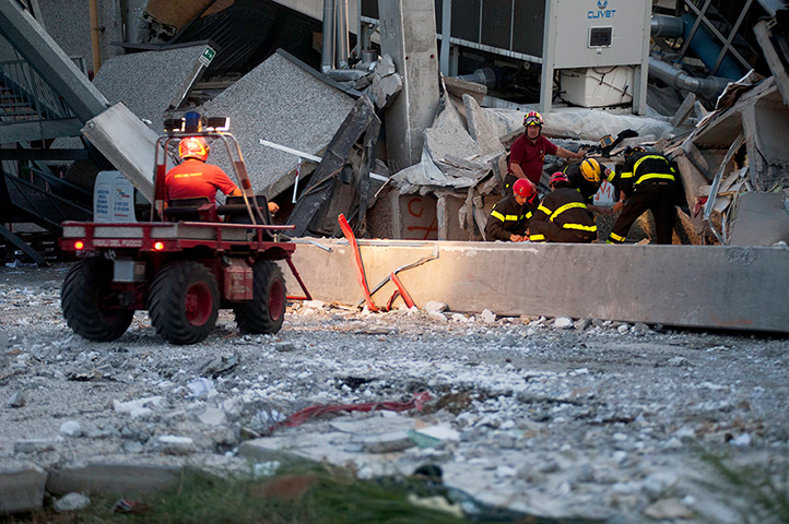 Italy earthquake: Rescue workers serach for a missing person at the Haemotronic plant