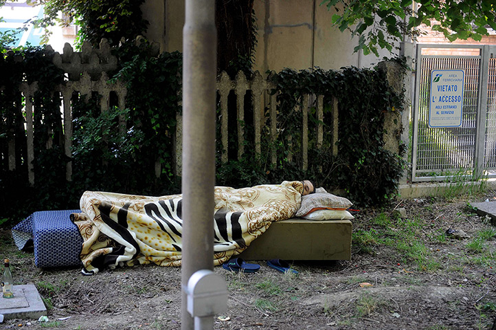 Italy earthquake: A man sleeps in a park in Crevalcore