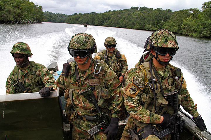 24 hours: Buenaventura, Colombia: Colombian soldiers patrol the Cajambre river