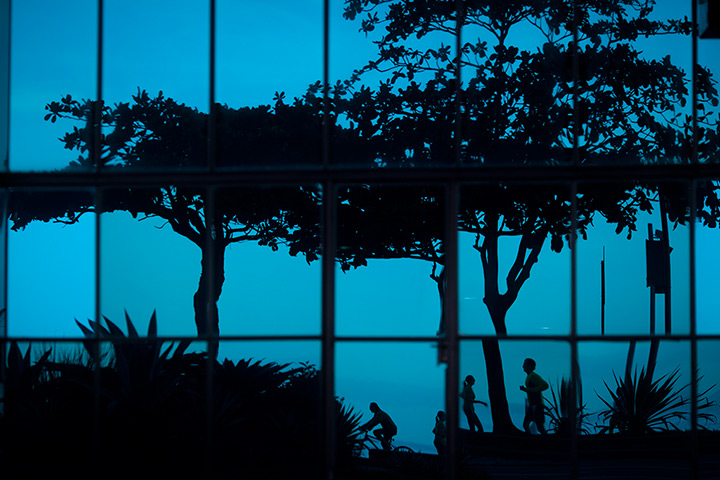 24 hours: Rio de Janeiro, Brazil: People are reflected in a beachfront apartment 
