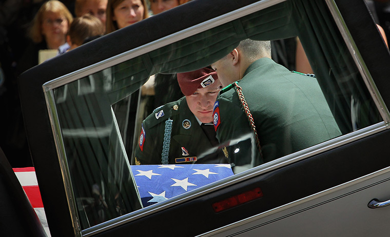 24 hours in pictures: Funeral Held For Solider Killed In Afghanistan