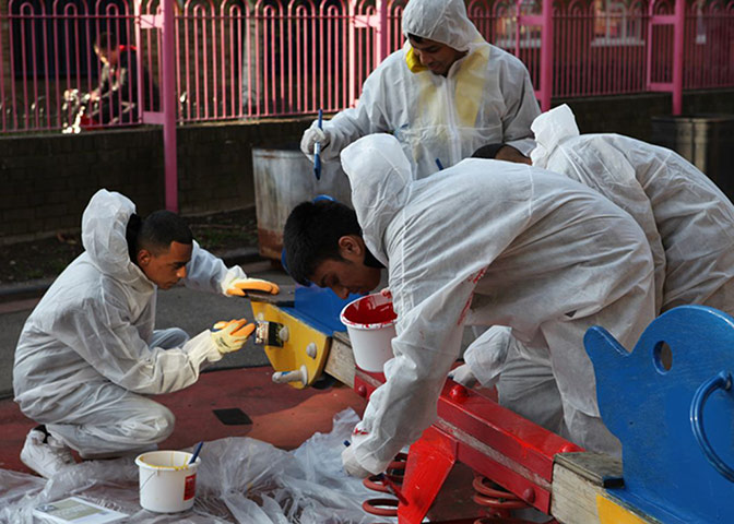 tower hamlets gallery: Young people paint a play area