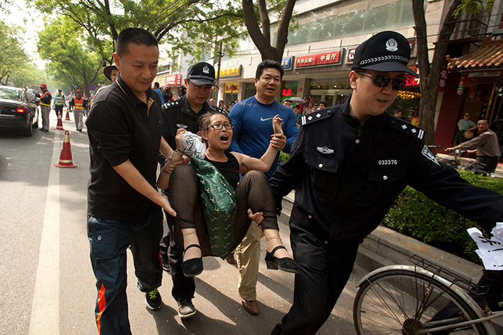 Picture Desk Live: Protest outside the hospital in Beijing where  Chen Guangcheng is staying