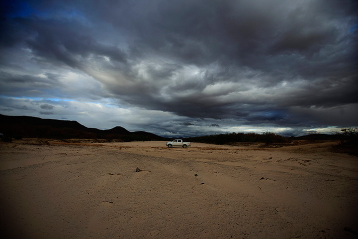 24 hours in pictures: Residents drive over the dried Rio de Contas river in in Bahia, Brazil