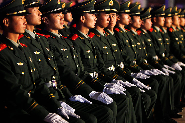 Week in film: Chinese soldiers watch the closing ceremony of the Beijing Film Festival