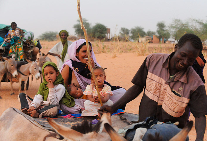 Longer View: a Malian refugee, arrives with family members