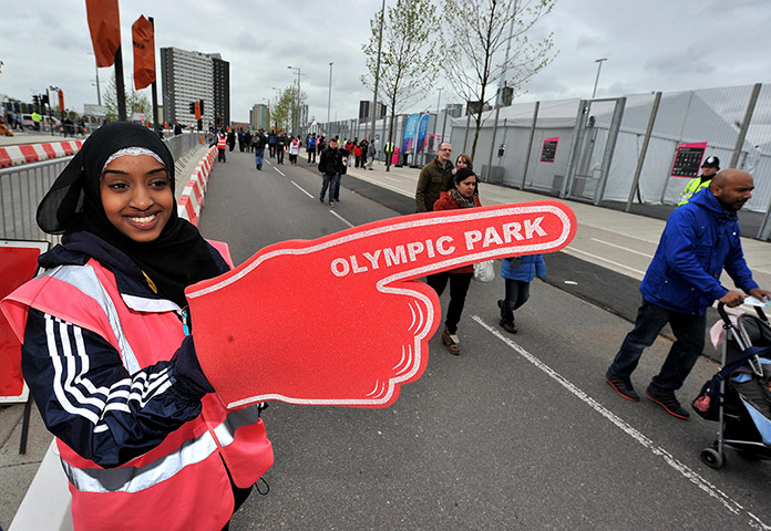 Olympic Park: A volunteer points the way to the Olympic Park 