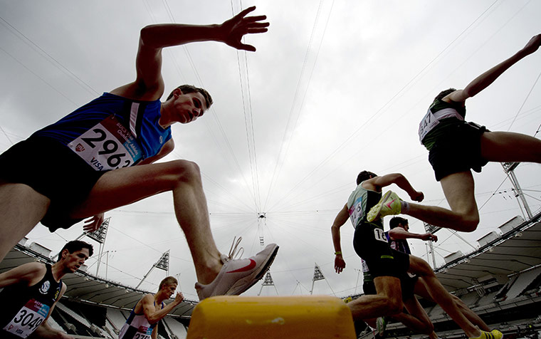 Olympics test event: Competitors jump the water hurdle during the Men's 3000 metres steeplechase