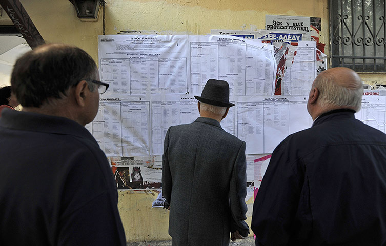 European elections: People check voting lists outside a polling station in Thessaloniki