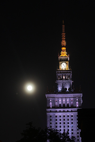 Supermoon: The moon next to the Palace of Culture and Science in Warsaw, Poland